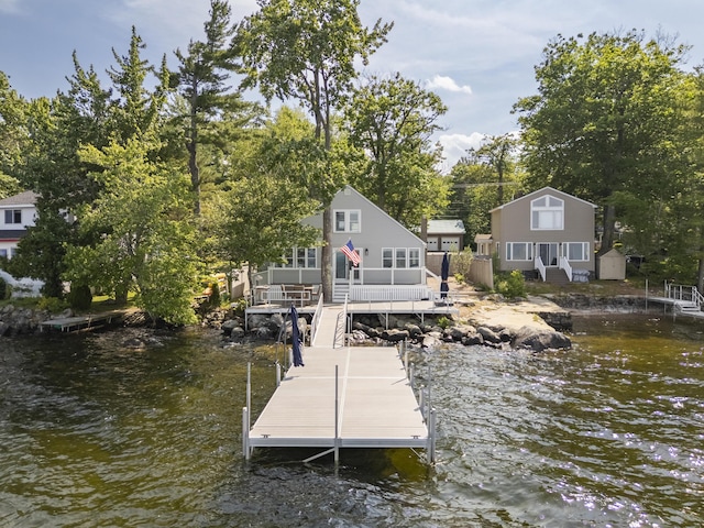 1485 Richville Rd, Standish, ME 04084 - dock area featuring stairway, a deck with water view, and view of wooded area