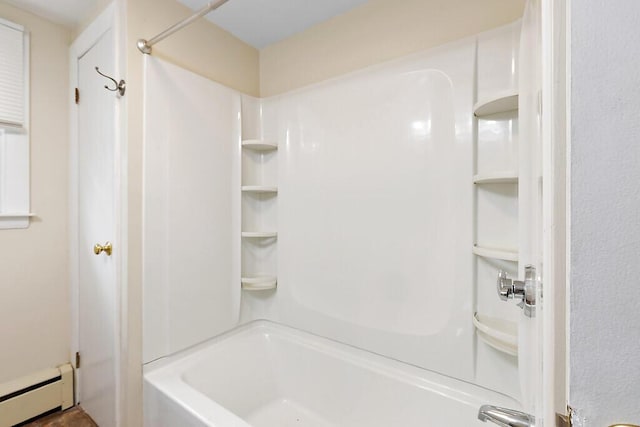 full bathroom featuring baseboard heating and shower / bathtub combination