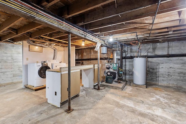 unfinished basement with washing machine and dryer, gas water heater, and a heating unit