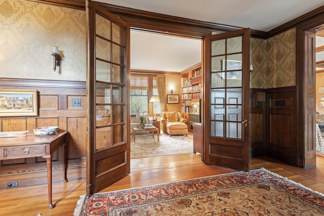 70 Carroll St, Portland, ME 04102 - office with wood finished floors, crown molding, wallpapered walls, and french doors