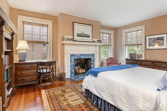 70 Carroll St, Portland, ME 04102 - bedroom with hardwood / wood-style floors, crown molding, a fireplace, and radiator