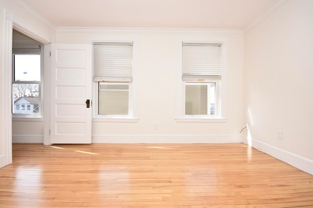 105 N St Unit 3, Portland, ME 04101 - unfurnished room with light wood-style flooring, baseboards, and crown molding