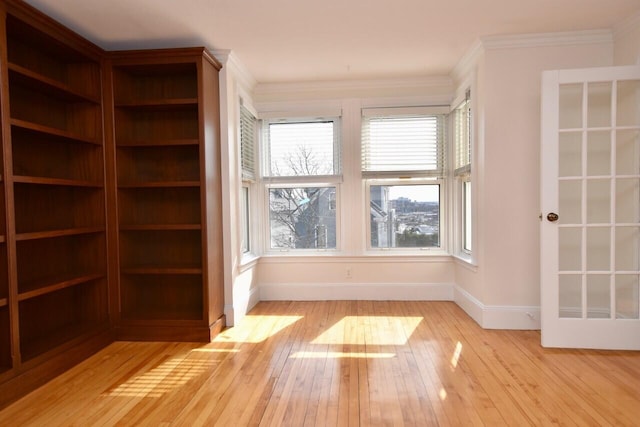 105 N St Unit 3, Portland, ME 04101 - spare room with baseboards, hardwood / wood-style floors, and crown molding