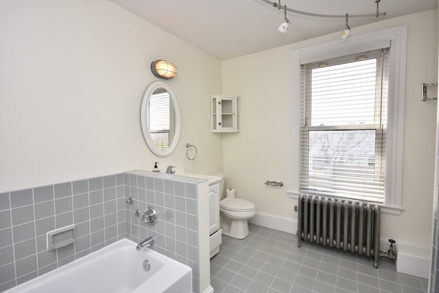 105 N St Unit 3, Portland, ME 04101 - full bathroom with radiator, toilet, tile patterned floors, a tub, and baseboards