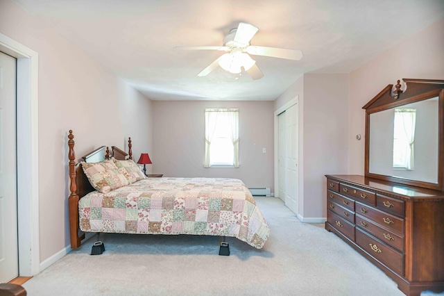 bedroom with a ceiling fan, baseboards, light carpet, and baseboard heating