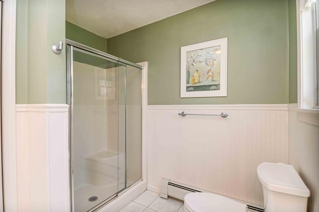 full bathroom with toilet, wainscoting, and a stall shower