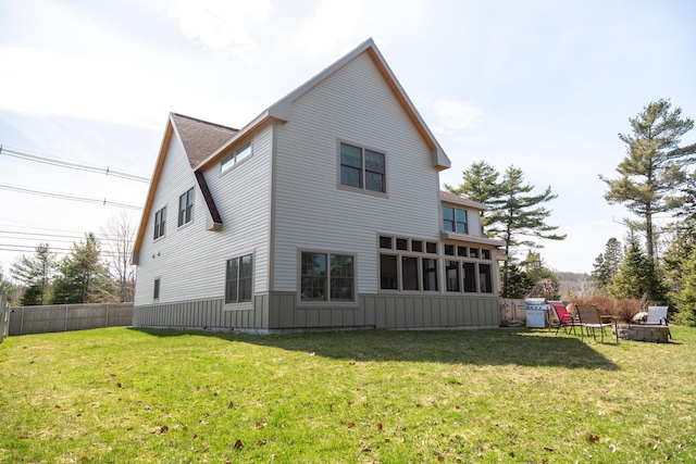 3 Bogue Chitto Ln Unit 1, Bar Harbor, ME 04609 - rear view of house featuring fence, board and batten siding, a yard, and roof with shingles