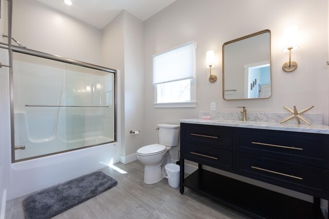 3 Bogue Chitto Ln Unit 1, Bar Harbor, ME 04609 - full bathroom featuring vanity, shower / bath combination with glass door, baseboards, and toilet