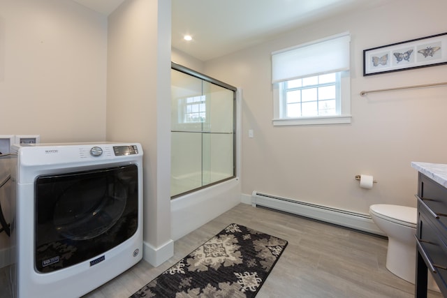 3 Bogue Chitto Ln Unit 1, Bar Harbor, ME 04609 - full bath with washer / clothes dryer, baseboard heating, vanity, toilet, and shower / bath combination with glass door