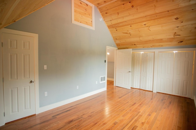 16 Main St, Bradley, ME 04411 - unfurnished bedroom featuring vaulted ceiling, wooden ceiling, light wood-style floors, and two closets