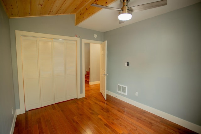 16 Main St, Bradley, ME 04411 - unfurnished bedroom featuring vaulted ceiling, wooden ceiling, a closet, wood finished floors, and a ceiling fan