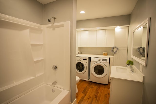 16 Main St, Bradley, ME 04411 - bathroom featuring washing machine and clothes dryer, shower / bathtub combination, wood finished floors, vanity, and recessed lighting