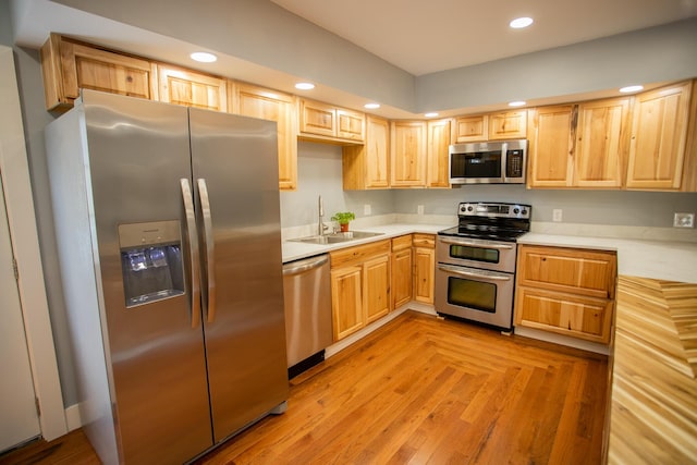 16 Main St, Bradley, ME 04411 - kitchen with stainless steel appliances, light brown cabinets, light countertops, and recessed lighting