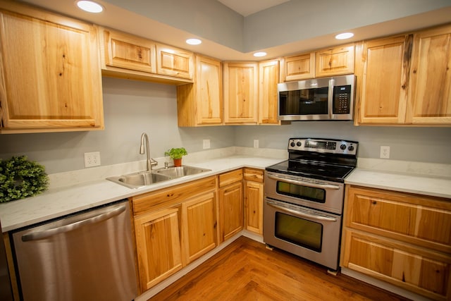 16 Main St, Bradley, ME 04411 - kitchen with appliances with stainless steel finishes, light countertops, light brown cabinets, and recessed lighting