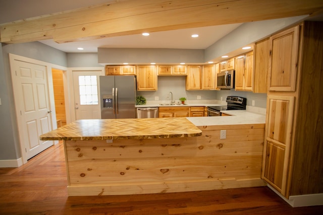 16 Main St, Bradley, ME 04411 - kitchen with stainless steel appliances, light brown cabinets, a peninsula, recessed lighting, and wood finished floors