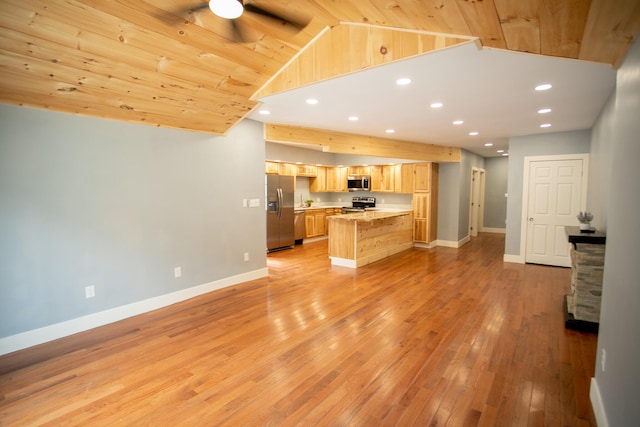 16 Main St, Bradley, ME 04411 - kitchen with appliances with stainless steel finishes, light brown cabinets, light wood-style flooring, vaulted ceiling, and light countertops