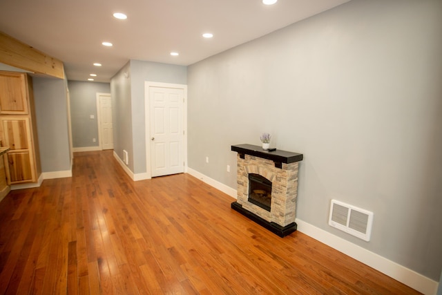 16 Main St, Bradley, ME 04411 - unfurnished living room featuring recessed lighting, wood finished floors, and a fireplace
