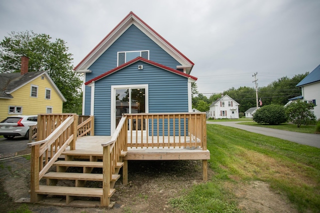 16 Main St, Bradley, ME 04411 - rear view of house featuring a deck and a lawn