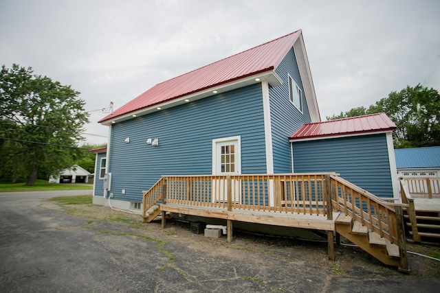 16 Main St, Bradley, ME 04411 - back of house featuring a metal roof and a wooden deck