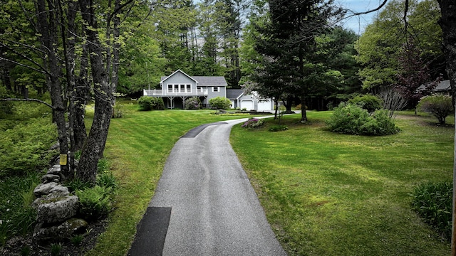 29 Bear Pond Rd, Waterford, ME 04088 - view of front facade with a front yard, asphalt driveway, and a garage
