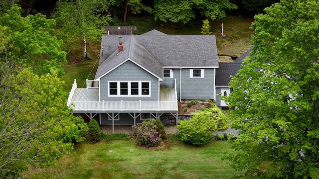 29 Bear Pond Rd, Waterford, ME 04088 - back of property featuring a chimney, roof with shingles, a wooden deck, and a yard