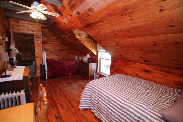 81 Shore Dr, Sabattus, ME 04280 - bedroom with wooden walls, wood-type flooring, radiator, lofted ceiling, and wooden ceiling