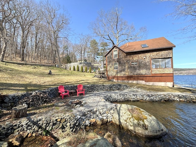 81 Shore Dr, Sabattus, ME 04280 - view of yard featuring a fire pit and a water view