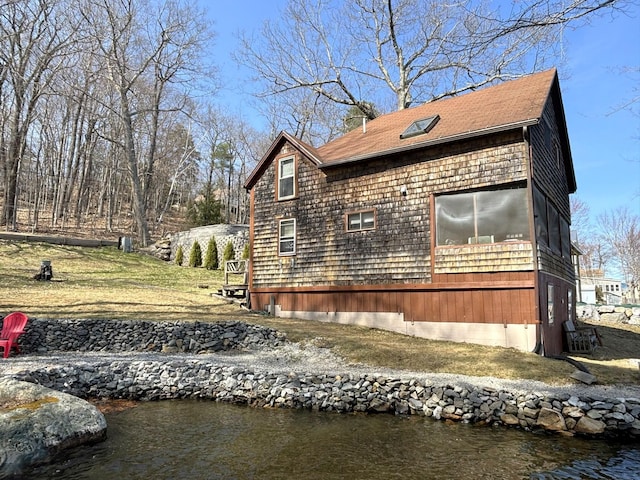81 Shore Dr, Sabattus, ME 04280 - view of property exterior with roof with shingles