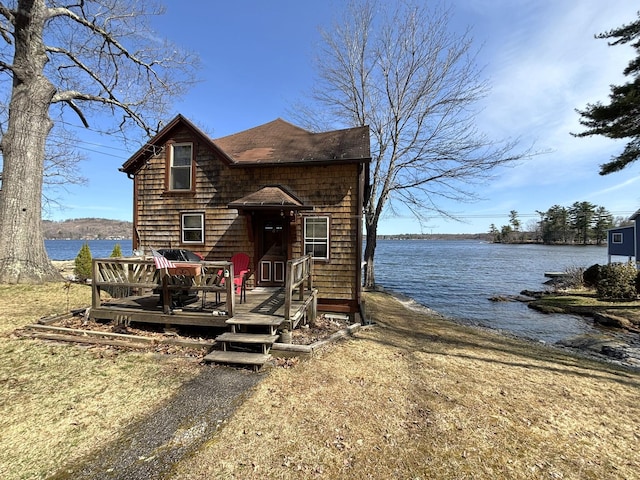 81 Shore Dr, Sabattus, ME 04280 - view of front of property featuring a deck with water view and a shingled roof