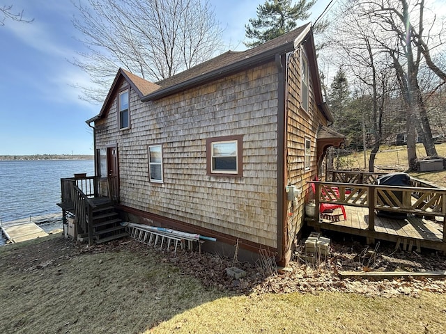 81 Shore Dr, Sabattus, ME 04280 - view of side of home with a deck with water view