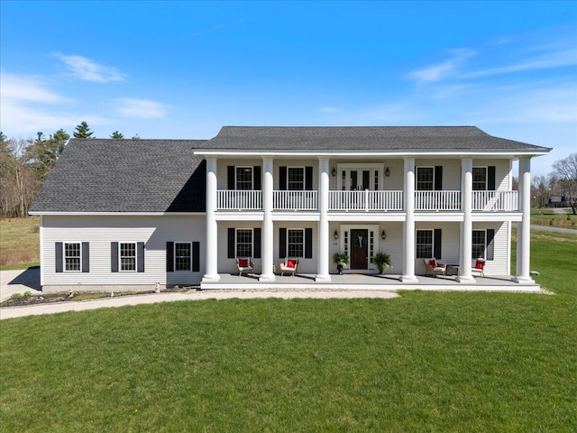 66 Grant Rd, Saco, ME 04072 - rear view of house with a porch, a shingled roof, a yard, and a balcony