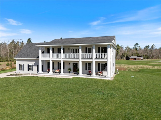 66 Grant Rd, Saco, ME 04072 - back of house featuring a patio area, a yard, a balcony, and roof with shingles