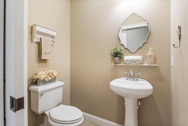 66 Grant Rd, Saco, ME 04072 - bathroom featuring a sink, baseboards, and toilet