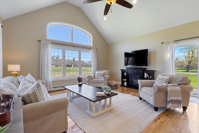 66 Grant Rd, Saco, ME 04072 - living room with light wood-style floors, high vaulted ceiling, and a ceiling fan