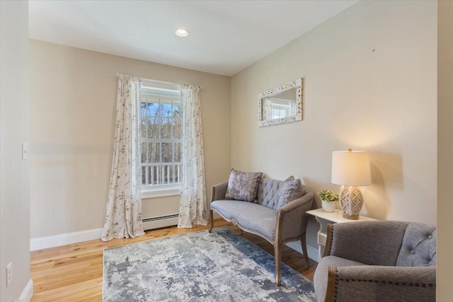 66 Grant Rd, Saco, ME 04072 - living area with baseboards, recessed lighting, wood finished floors, and baseboard heating