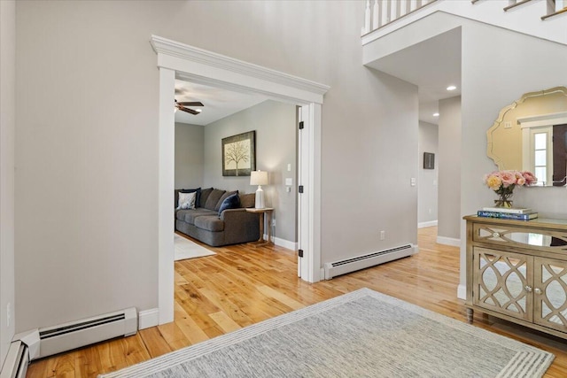 66 Grant Rd, Saco, ME 04072 - foyer entrance featuring a baseboard radiator and wood finished floors