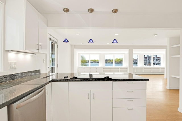 kitchen with stainless steel dishwasher, dark stone counters, black electric cooktop, and white cabinets