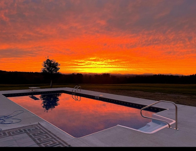 219 Middle Rd, Skowhegan, ME 04976 - pool at dusk with an outdoor pool and a diving board