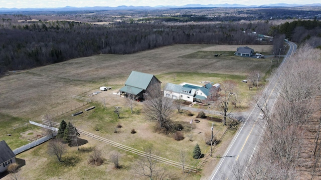 219 Middle Rd, Skowhegan, ME 04976 - view of property location featuring a mountainous background, a forest, and rural landscape