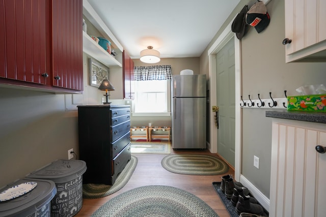 219 Middle Rd, Skowhegan, ME 04976 - kitchen featuring freestanding refrigerator and wood finished floors