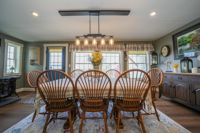 219 Middle Rd, Skowhegan, ME 04976 - dining space featuring recessed lighting, dark wood finished floors, baseboards, and a wood stove