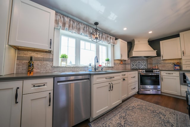 219 Middle Rd, Skowhegan, ME 04976 - kitchen featuring stainless steel appliances, custom exhaust hood, tasteful backsplash, dark countertops, and recessed lighting