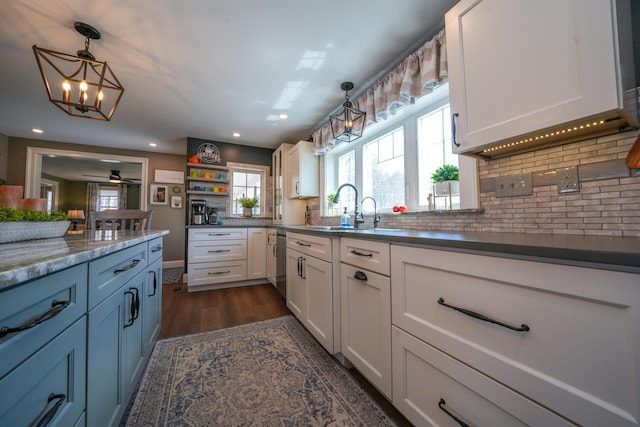 219 Middle Rd, Skowhegan, ME 04976 - kitchen featuring a sink, white cabinetry, dishwasher, a chandelier, and decorative light fixtures