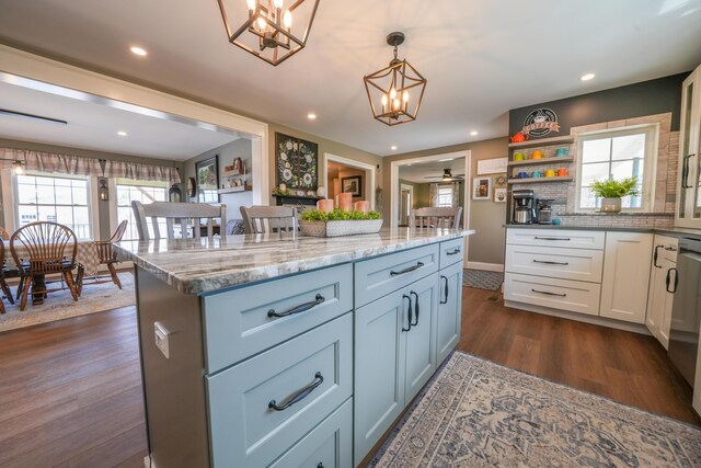 219 Middle Rd, Skowhegan, ME 04976 - kitchen with dark wood-type flooring, a chandelier, plenty of natural light, white cabinetry, and recessed lighting