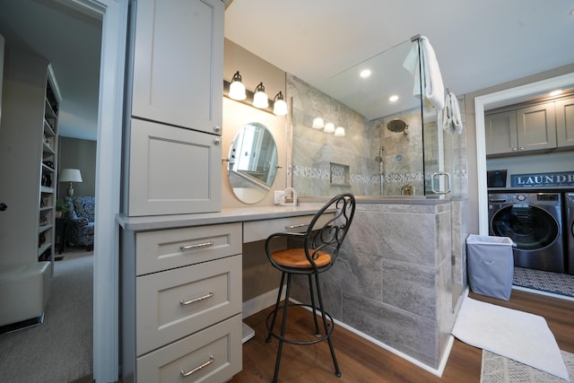 219 Middle Rd, Skowhegan, ME 04976 - bathroom with washer / clothes dryer, wood finished floors, a shower stall, vanity, and recessed lighting