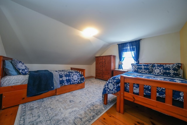 219 Middle Rd, Skowhegan, ME 04976 - bedroom featuring light wood-style flooring and vaulted ceiling