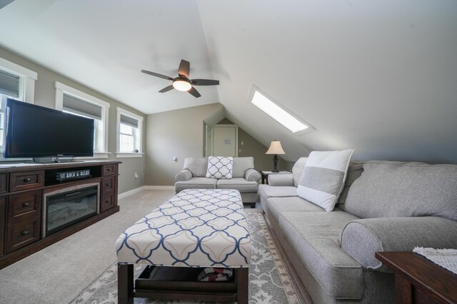 219 Middle Rd, Skowhegan, ME 04976 - living area with a ceiling fan, light colored carpet, a skylight, lofted ceiling, and baseboards