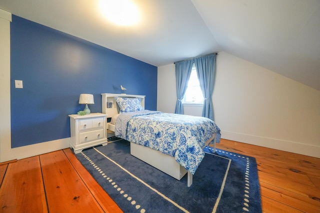 219 Middle Rd, Skowhegan, ME 04976 - bedroom with lofted ceiling, wood finished floors, and baseboards