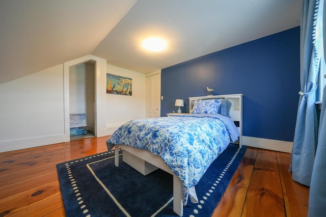 219 Middle Rd, Skowhegan, ME 04976 - bedroom with hardwood / wood-style floors, baseboards, and lofted ceiling