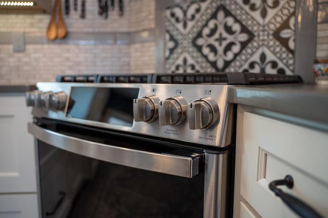 219 Middle Rd, Skowhegan, ME 04976 - kitchen view of stainless steel range and decorative backsplash
